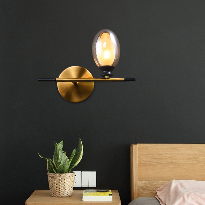Rynx | Brass straight bar wall light Mid Century 1 head metal wall light ideas with dual oval clear/amber glass shade