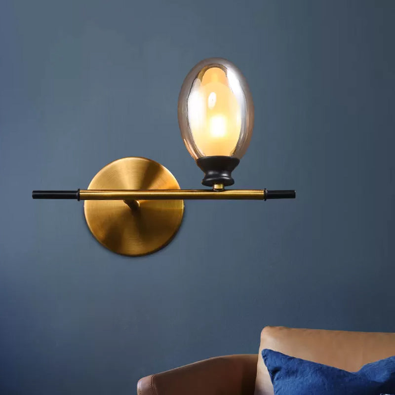 Rynx | Brass straight bar wall light Mid Century 1 head metal wall light ideas with dual oval clear/amber glass shade