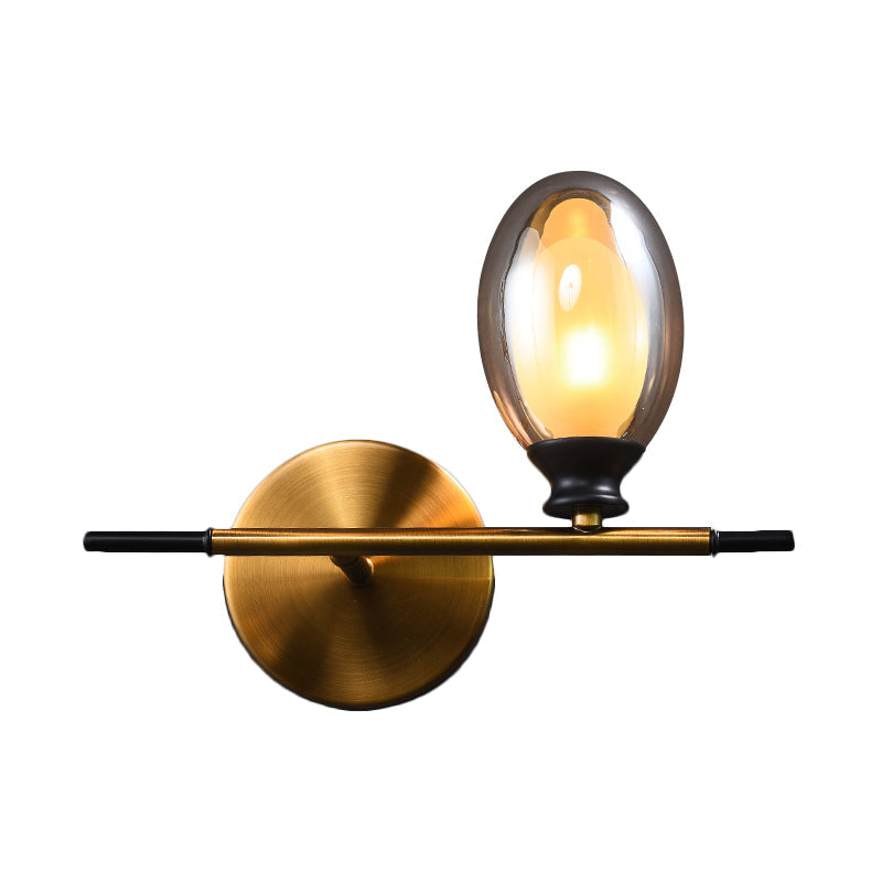 Rynx | Brass straight bar wall light Mid Century 1 head metal wall light ideas with dual oval clear/amber glass shade