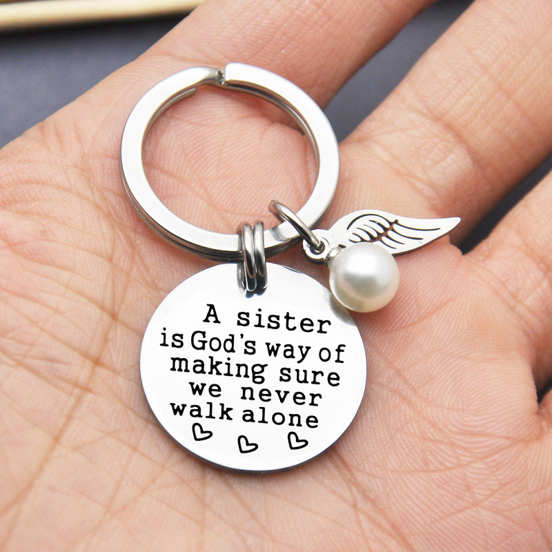 Rynx | A sister is God's way of ensuring that we never walk alone keychain