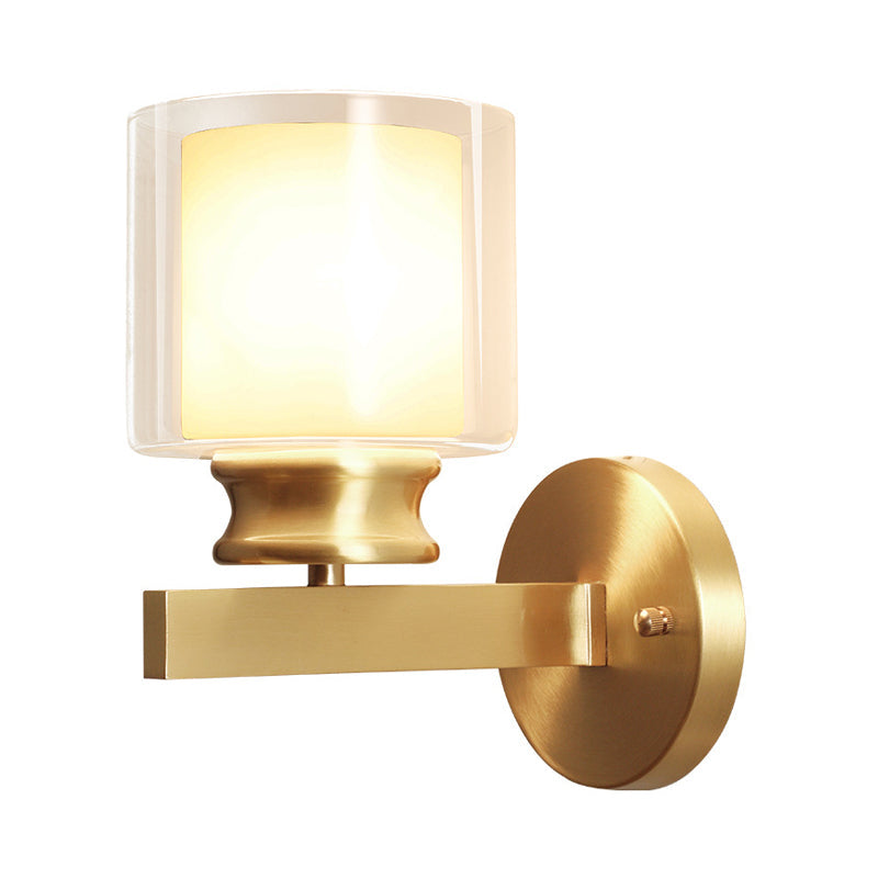 Rynx | Modern Style Cylindrical Wall Light 1 Light Clear and White Glass Wall Mount Lamp in Brass for Bedroom