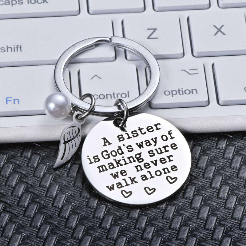 Rynx | A sister is God's way of ensuring that we never walk alone keychain