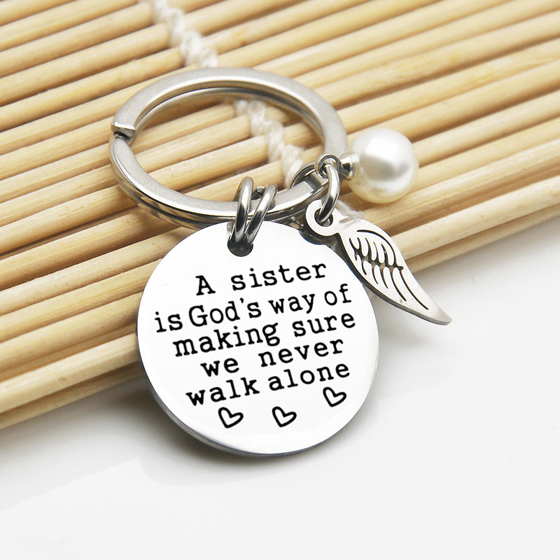Rynx | A sister is God's way of ensuring that we never walk alone keychain