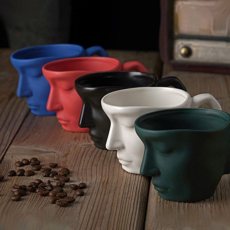 Rynx | Metal touching face, creative ceramic kiss coffee mug