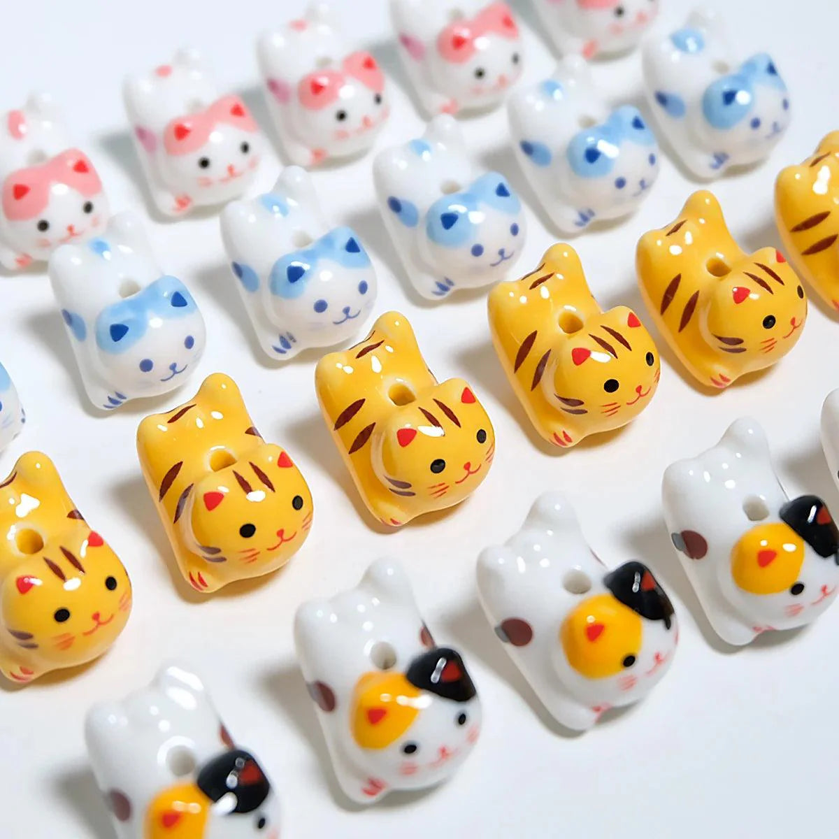 Rynx | Charming anime-inspired lucky cat ceramic beads for creative jewelry projects - 15x21mm porcelain essentials with vertical hole
