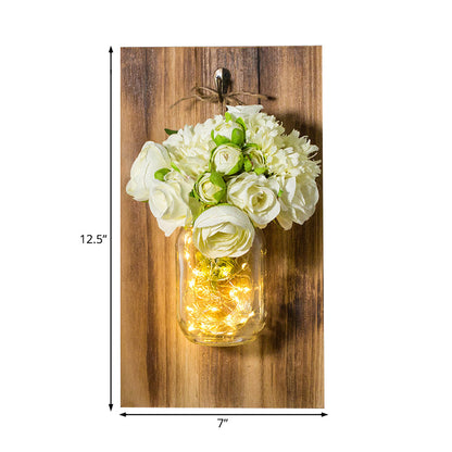 Rynx | Modern white rose string lamp with clear glass container and wooden back panel
