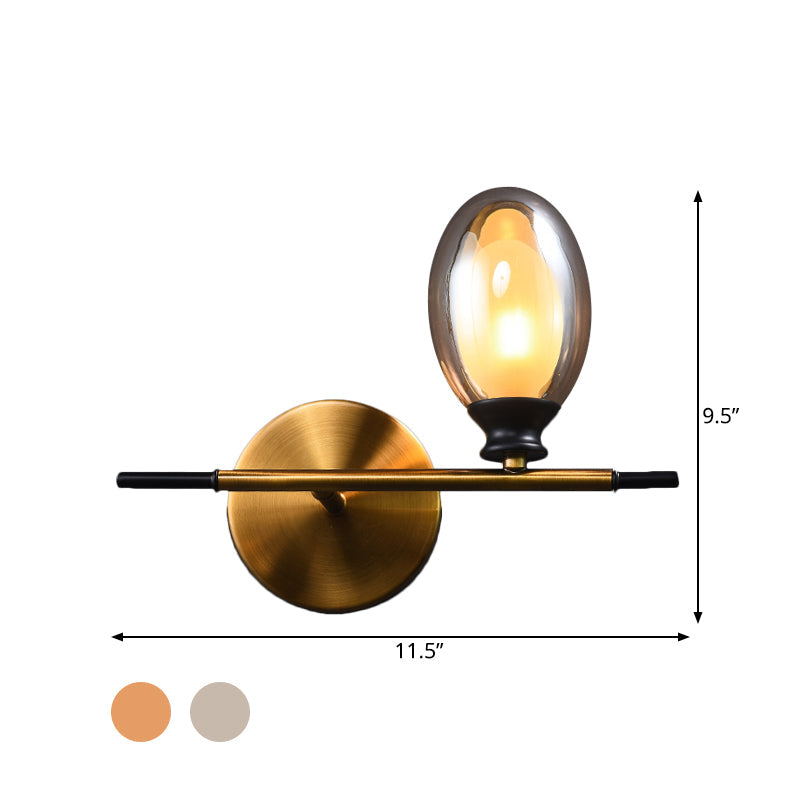Rynx | Brass straight bar wall light Mid Century 1 head metal wall light ideas with dual oval clear/amber glass shade