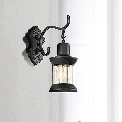 Rynx | Lantern Clear Glass Wall Mounted Lamp Vintage Single Bulb Outdoor Wall Light in Black with Carved Pattern