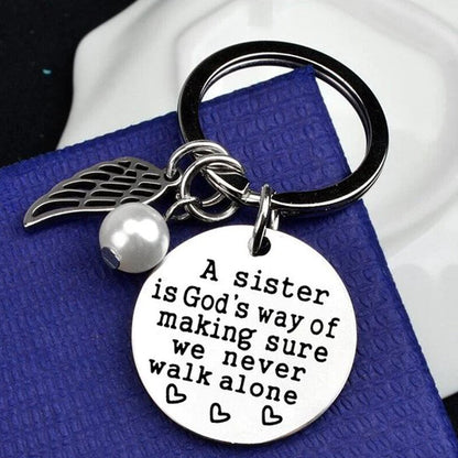 Rynx | A sister is God's way of ensuring that we never walk alone keychain