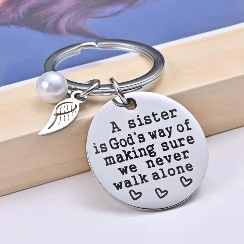 Rynx | A sister is God's way of ensuring that we never walk alone keychain
