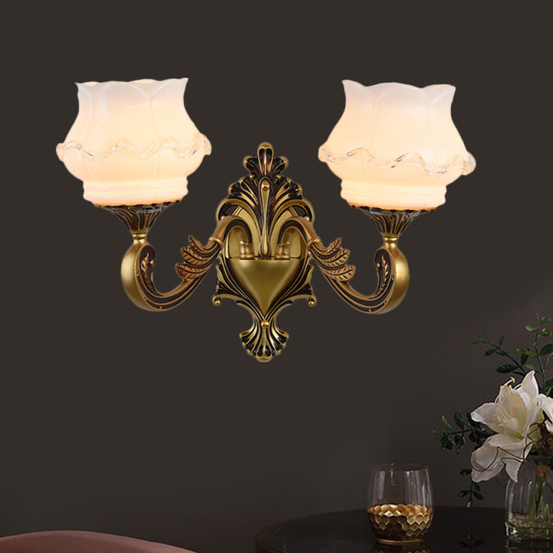 Rynx | Vintage Curved Arm Wall Lighting Idea 1/2-Ball Metal Wall Lamp in Brass with Floral Milk Glass Shade