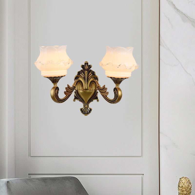 Rynx | Vintage Curved Arm Wall Lighting Idea 1/2-Ball Metal Wall Lamp in Brass with Floral Milk Glass Shade