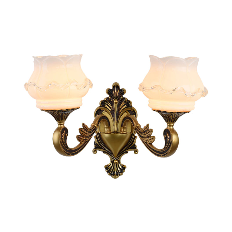 Rynx | Vintage Curved Arm Wall Lighting Idea 1/2-Ball Metal Wall Lamp in Brass with Floral Milk Glass Shade