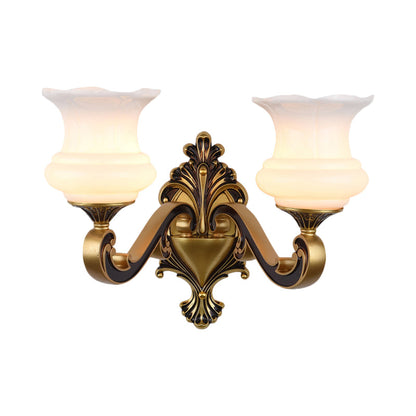 Rynx | Vintage Curved Arm Wall Lighting Idea 1/2-Ball Metal Wall Lamp in Brass with Floral Milk Glass Shade