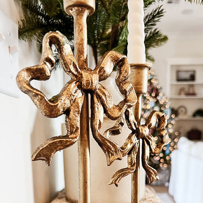 Rynx | Ornate bows antique gold cast iron candle holders, set of two