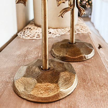 Rynx | Ornate bows antique gold cast iron candle holders, set of two