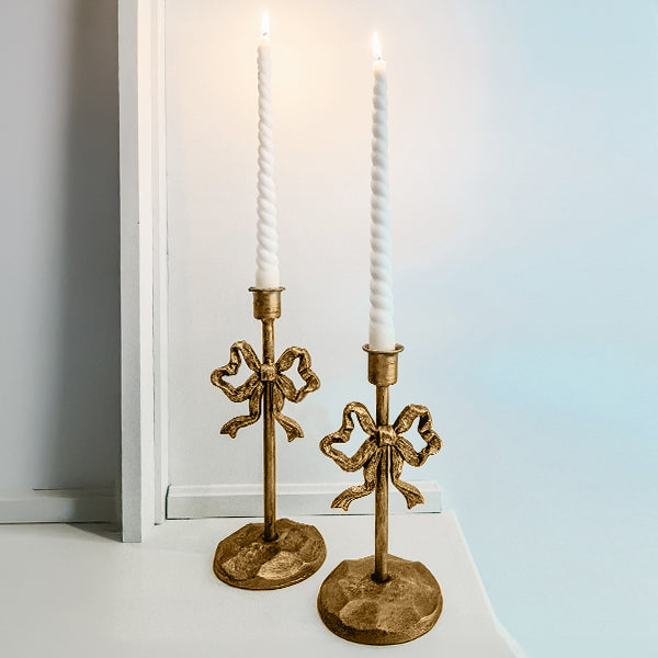 Rynx | Ornate bows antique gold cast iron candle holders, set of two