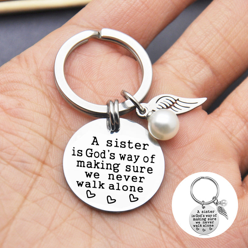 Rynx | A sister is God's way of ensuring that we never walk alone keychain