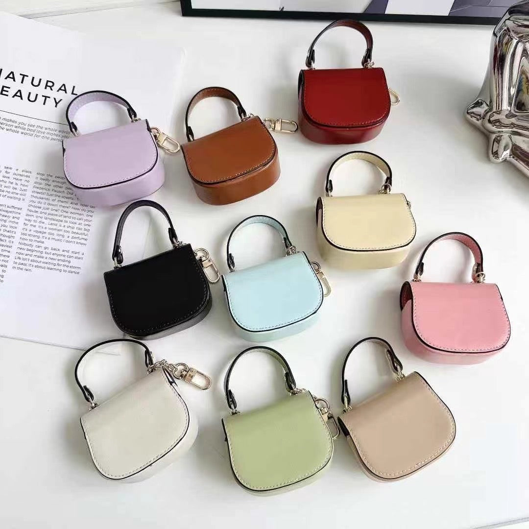 Rynx | Luxurious branded leather handbag style for Airpod with gold-colored accent buckle