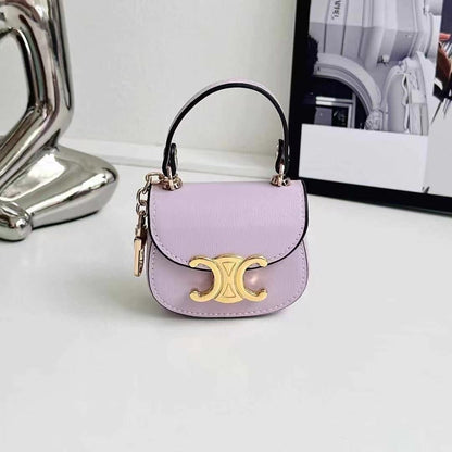 Rynx | Luxurious branded leather handbag style for Airpod with gold-colored accent buckle