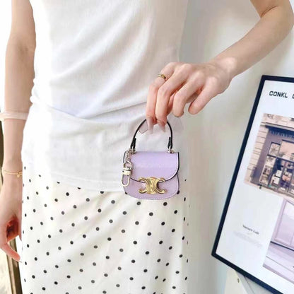Rynx | Luxurious branded leather handbag style for Airpod with gold-colored accent buckle
