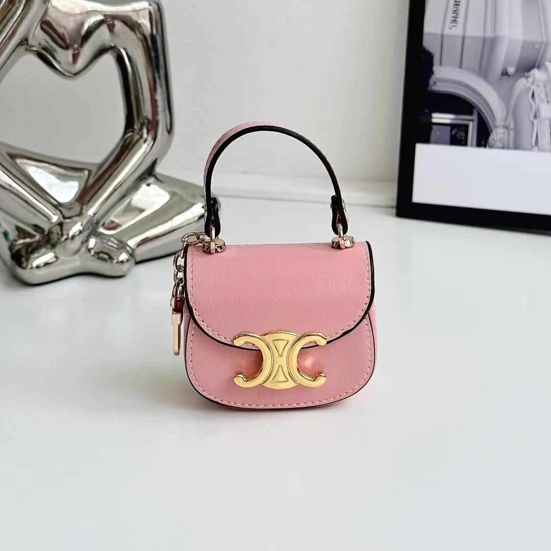 Rynx | Luxurious branded leather handbag style for Airpod with gold-colored accent buckle