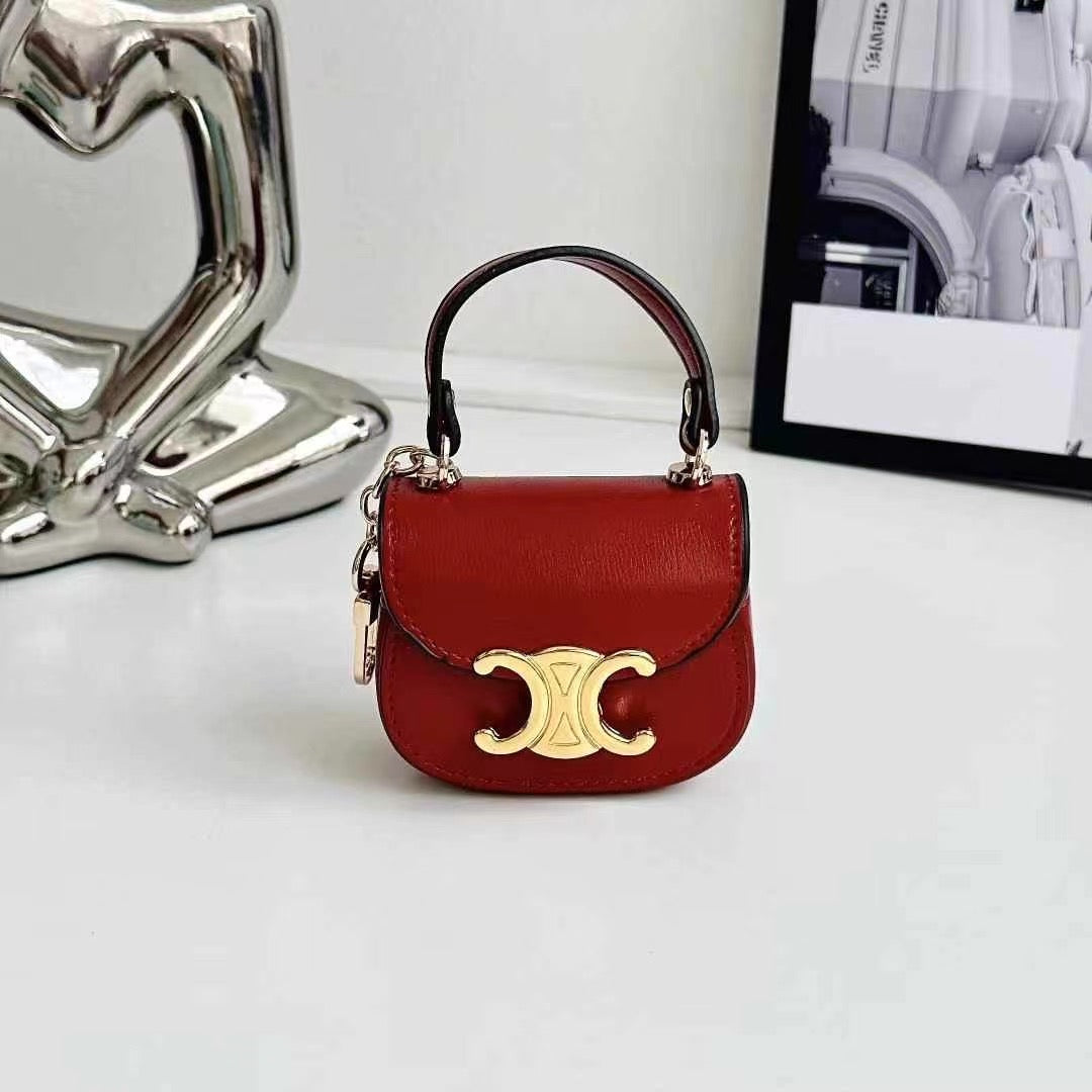 Rynx | Luxurious branded leather handbag style for Airpod with gold-colored accent buckle