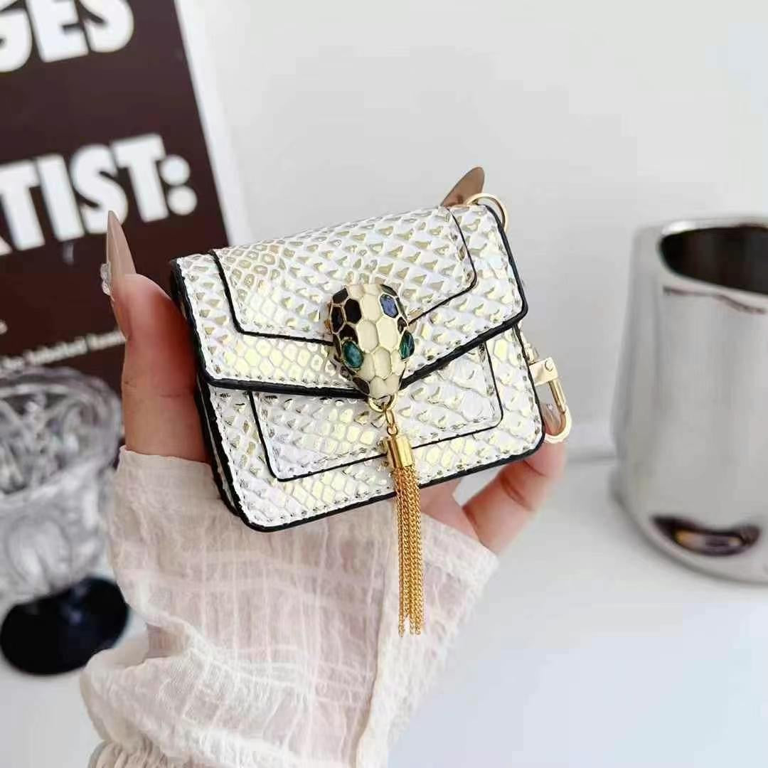 Rynx | Mini Luxury Bag Style AirPods Case – Snake Pattern PU Leather with Tassel & Chain