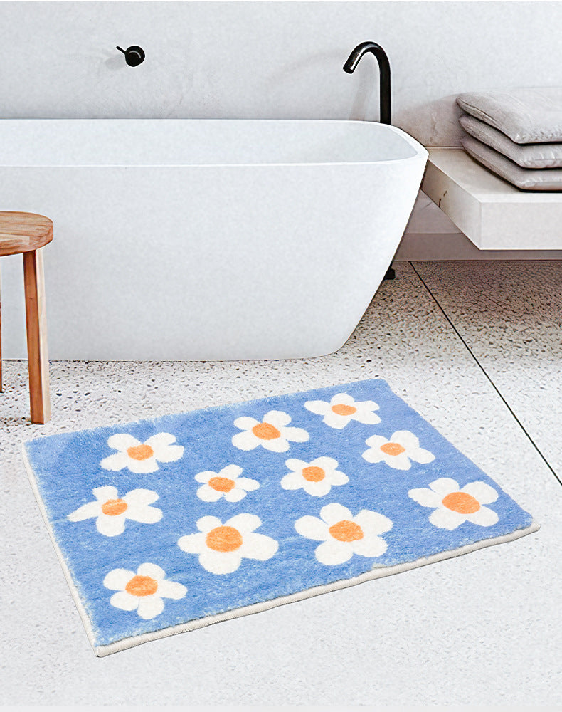 Rynx | White flowers on blue background bath mat