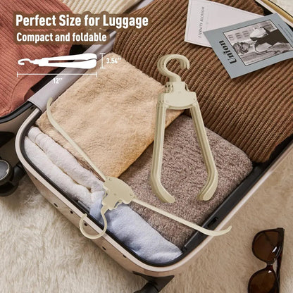Rynx | Robust foldable clothes hanger with one-button function and crease pRedection