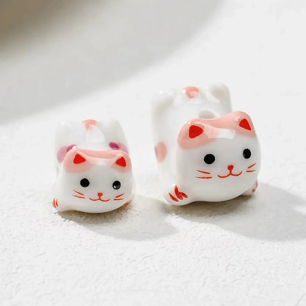 Rynx | Charming anime-inspired lucky cat ceramic beads for creative jewelry projects - 15x21mm porcelain essentials with vertical hole