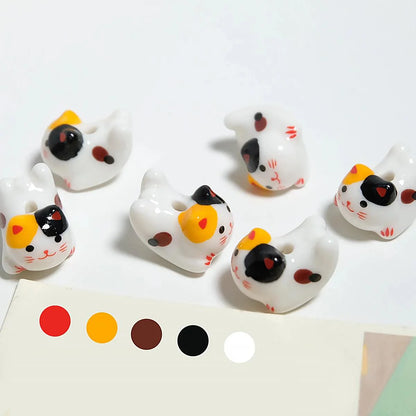 Rynx | Charming anime-inspired lucky cat ceramic beads for creative jewelry projects - 15x21mm porcelain essentials with vertical hole