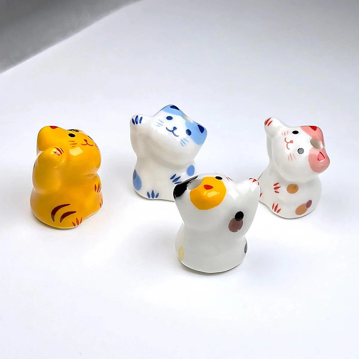 Rynx | Charming anime-inspired lucky cat ceramic beads for creative jewelry projects - 15x21mm porcelain essentials with vertical hole