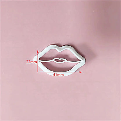 Rynx | Festive Creations Earring shape: Design Playful Red Lips & Charming Christmas House Shapes