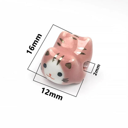 Rynx | Charming anime-inspired lucky cat ceramic beads for creative jewelry projects - 15x21mm porcelain essentials with vertical hole