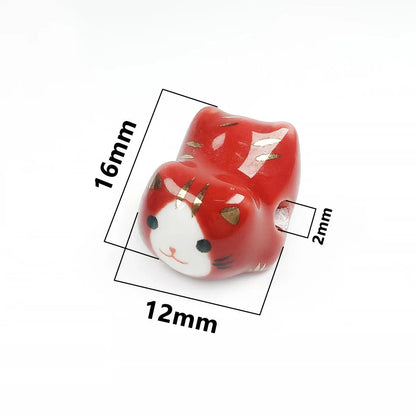Rynx | Charming anime-inspired lucky cat ceramic beads for creative jewelry projects - 15x21mm porcelain essentials with vertical hole