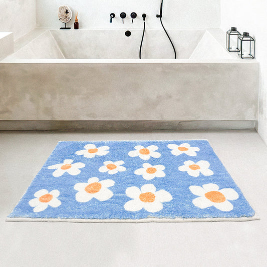 Rynx | White flowers on blue background bath mat