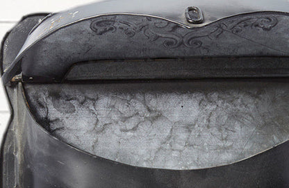 Rynx | Worn black metal mailbox