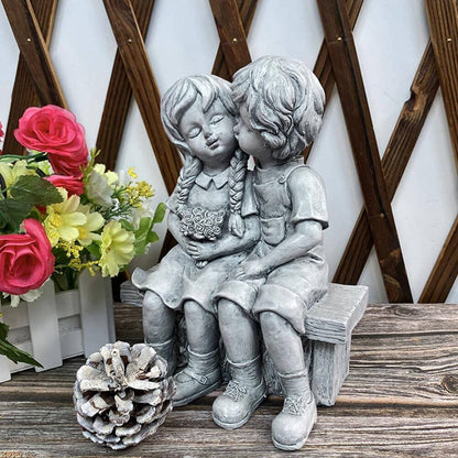 Rynx | Boy Kissing Girl Statue Sitting on Bench Figure