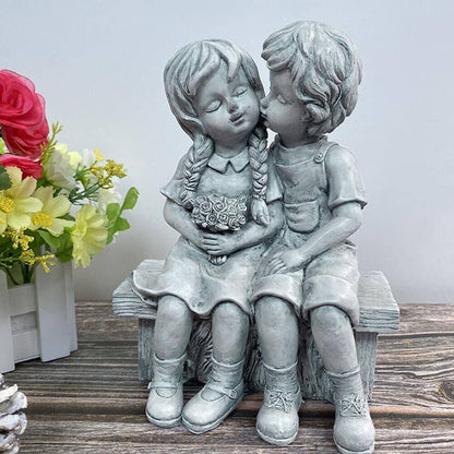 Rynx | Boy Kissing Girl Statue Sitting on Bench Figure