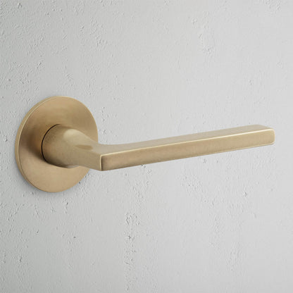 Rynx | Clayton Flush Rose Spring Door Handle - Antique Brass
