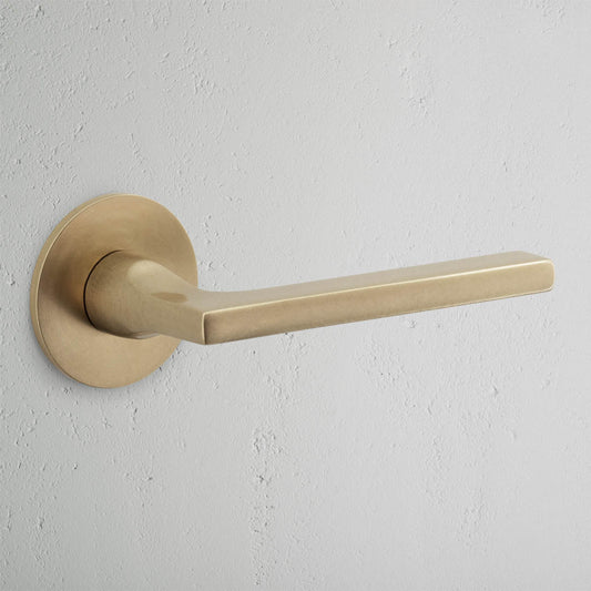 Rynx | Clayton Flush Rose Spring Door Handle - Antique Brass