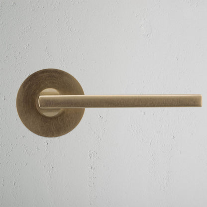 Rynx | Clayton Flush Rose Spring Door Handle - Antique Brass